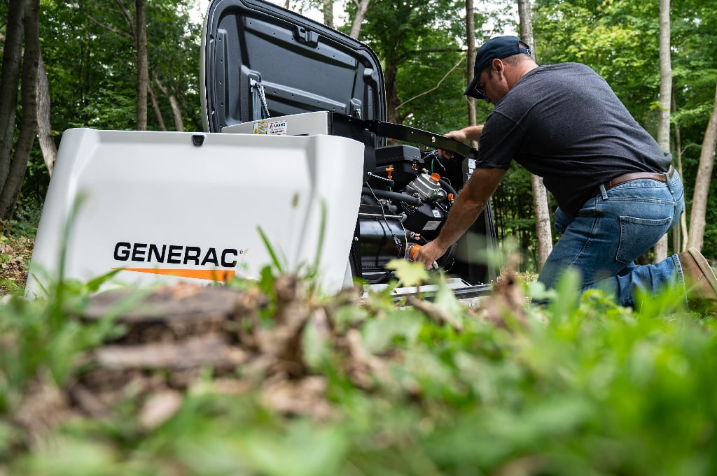 Technician working on a Generac standby generator
